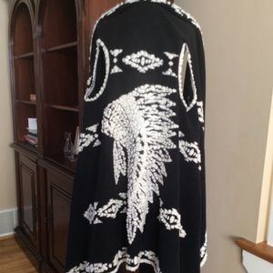 Statement sleeveless draped wrap/cardigan